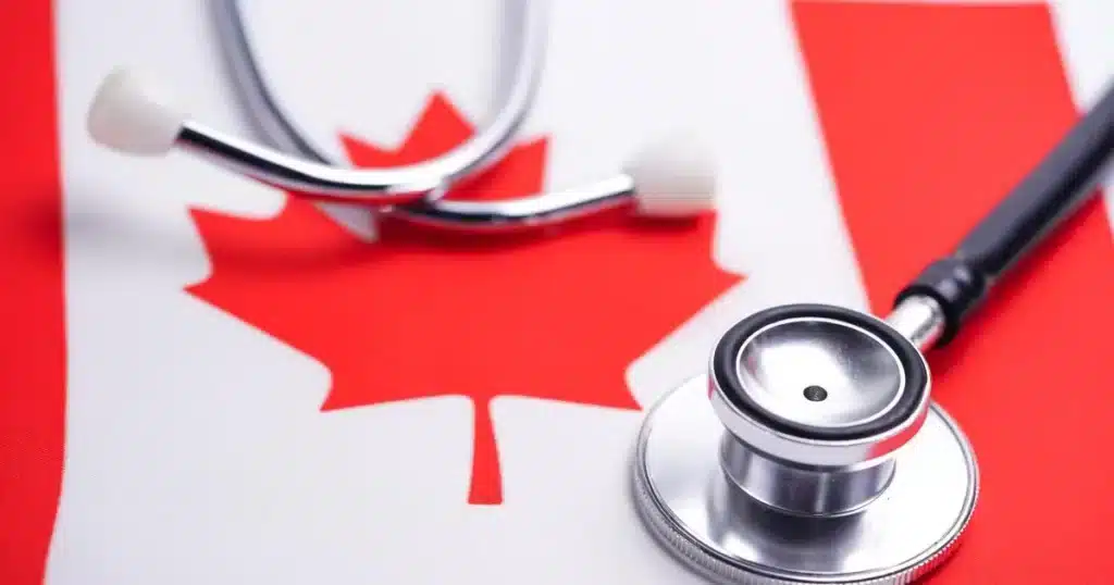 Stethoscope on top of the Canadian flag