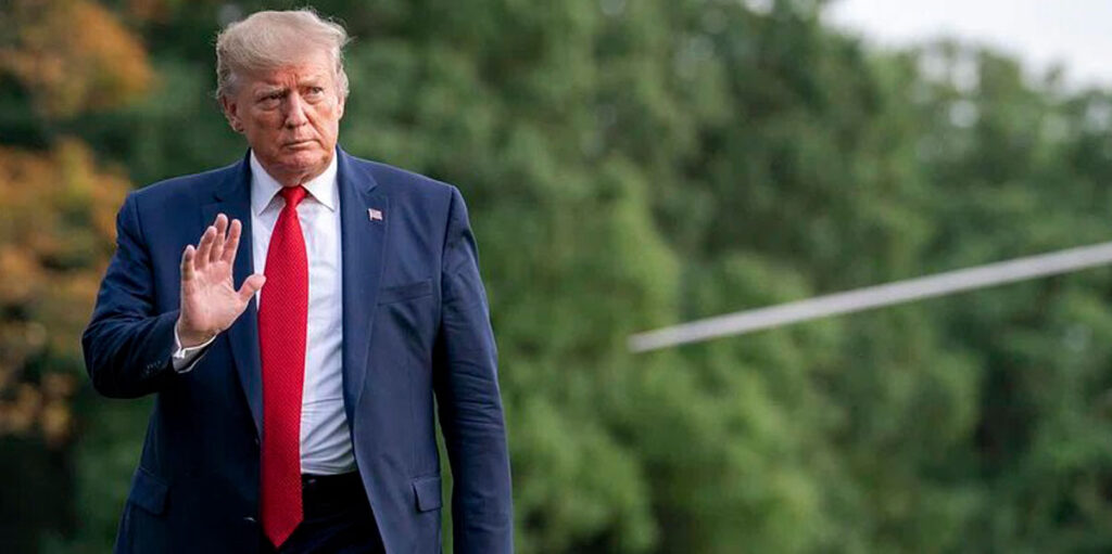 President Donald Trump waves